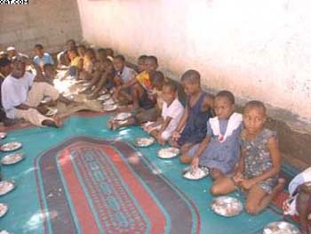 2004 - Giving food for orphans (1).jpg